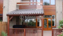 Lariks houten veranda's van Tuingenot zijn in verschillende stijlen verkrijgbaar.